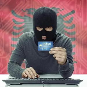 Mafia Prints: Dark-skinned hacker with credit card in hand and flag on background - Albania