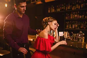 Flirt Prints: Date in nightclub, attractive couple against bar counter
