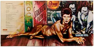 Fame Prints: David Bowie Diamond Dogs gatefold record album cover designed by Belgian artist Guy Peellaert was released 1974 by RCA