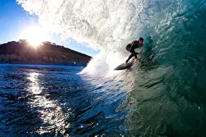 Surfer Prints: David Suhadolnik surfing in the tube at sunrise at Torrey Pines State Beach