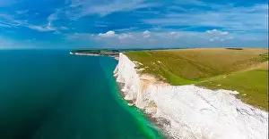 A daytime aerial drone view of the Seven Sisters cliffs on the East Sussex coast, UK