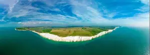 A daytime aerial drone view of the Seven Sisters cliffs on the East Sussex coast, UK
