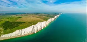 A daytime aerial drone view of the Seven Sisters cliffs on the East Sussex coast, UK