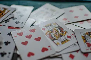 Chance Prints: A deck of playing cards scattered chaotically, background, wallpaper