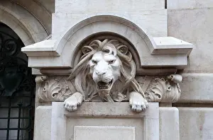 Lisboa Prints: Decorative stone lion on the historic Santander Totta Bank building in Lisbon
