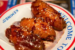 Delicious roasted chicken wings with Swiss sauce in a Hong Kong tea restaurant