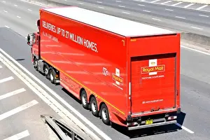 Deliveries up to 27 million homes advert on side of red Royal Mail articulated trailer with hgv lorry truck unit