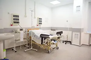 Sanitary Prints: Empty delivery room with bed and medical