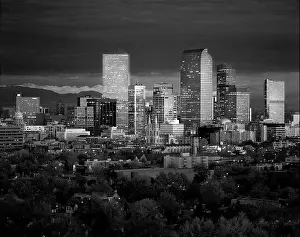 Denver Prints: Denver skyline glistens in front of the Rocky Mountains