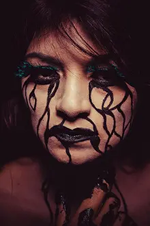 Teenage Prints: depression concept, crying woman with tears and makeup dark light