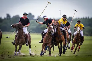 Pony Prints: Derek Bratley competes with Nick Pepper to gain control of the ball during a hard faught polo game at Cowdray Park