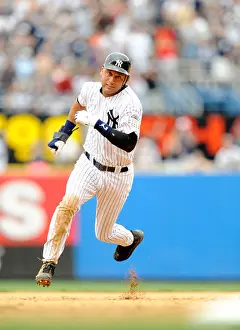 2008 Prints: Derek Jeter #2 of the New York Yankees runs the bases against the Tampa Bay Rays during their game at Yankee Stadium
