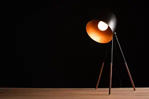 Illuminate Prints: Desk lamp on empty wooden office table as space for text or product placement