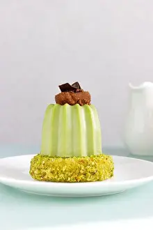 Glaze Prints: Dessert Pistachio mousse with cherry brownie on pistachio dacquoise on white plate