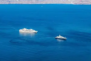 Destination sightseen with cruise ships on Santorini island, Aegean sea bay, Cyclades, Greece. Summer travel vacation, people on cruise ships