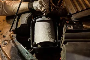 Diagnostics Prints: Detailed Inspection of an Air Filter in a Vehicle Engine Compartment