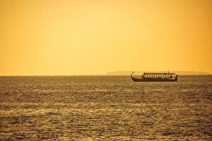 Images Dated 5th January 2017: Dhoni Maldivian boats on wonderful golden sunset in Maldives. Traditional wooden boat, sunset sea