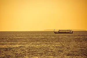 Maldives Island Prints: Dhoni Maldivian boats on wonderful golden sunset in Maldives