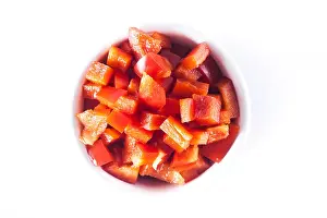 Bell Pepper Prints: Diced Red Pepper in white bowl