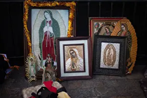 Our Lady Of Guadalupe Prints: Different images of the Virgin of Guadalupe are displayed at the pilgrimage to Our Lady of Guadalupe Basilica in Mexico