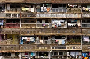 Disrepair Prints: Dilapidating Chawl facade low cost residential flats with common toilets Mumbai India