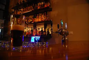 Bottles Prints: Dimly lit Interior of a bar