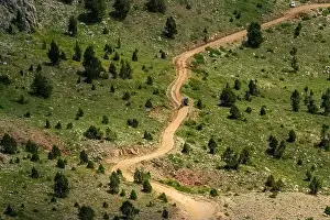 Mountain Pass Prints: A dirt road passing through the highlands. Footpath road work in the mountains in Turkey
