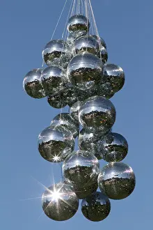 Suspended Prints: Disco Balls Suspended from a Crane against Clear Blue Sky