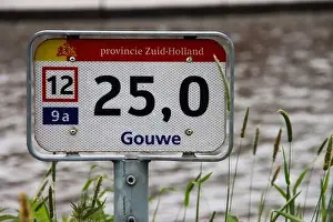 Zuidplaspolder Prints: Distance sign along Gouwe canal for ships on the water in the Netherlands