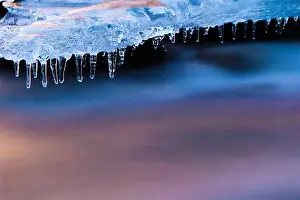 Icicle Prints: Djupin river, with ice and rocks at sunrise, Vik, Iceland