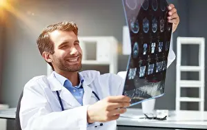 Explaining Prints: Doctor looking at x ray picture of head