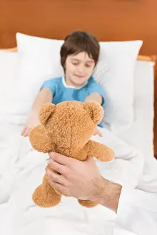 Remedy Prints: doctor showing child patient in bed teddy bear