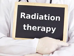 Assistant Prints: Doctor shows information: radiation therapy