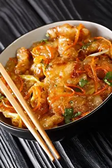 Stir Prints: Dongbei Guo Bao Rou Crispy Sweet and Sour Pork closeup on the bowl on the table. vertical