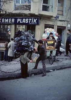 Salesman Prints: A door to door garment salesman gets loaded up in Istanbul, Turkey