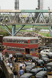 Rickshaw Prints: Double decker bus in traffic on Station road with Bandra pedestrian skywalk above