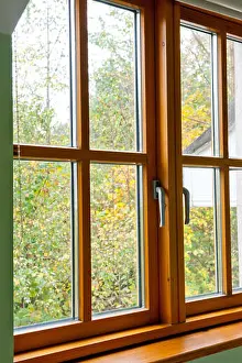 Glazed Prints: Double glazed wooden window frame in the home in the autumn season