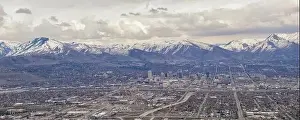 Mormonism Prints: Downtown Salt Lake City Panoramic view of Wasatch Front Rocky Mountains from airplane in early spring winter with