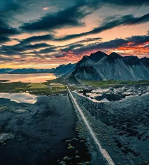 Difficulty Prints: Dramatic aerial view of sunset sky over Vestrahorn mountain