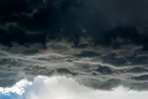 Cumulus Prints: Dramatic dark storm cloud front with rain coming down; Calgary, Alberta, Canada