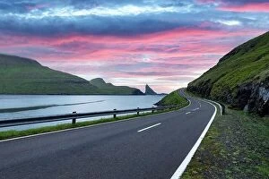 Images Dated 31st July 2019: Dramatic evening view of road and Tindholmur cliffs