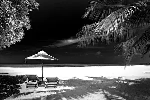 Dramatic landscape of paradise tropical island beach with perfect sunny sky, artistic black and white process
