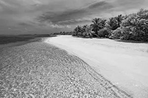 Dramatic landscape of paradise tropical island beach with perfect sunny sky, artistic black and white process