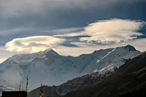 Rugged Terrain Prints: Dramatic Lenticular Clouds Over Snow-Capped Annapurna Peaks in Tanki Manang, Nepal
