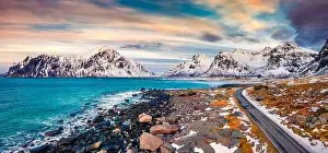 Ridge Peak Prints: Dramatic spring sunset on Vestvagoy island with asphalt road and drining car