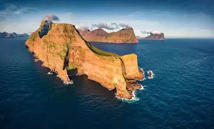Faroe Prints: Dramatic summer view from flying droneof Kallur Lighthouse on Kalsoy island