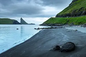 Dramatic view on Drangarnir and Tindholmur sea stacks in Atlantic ocean, Faroe Islands. Landscape photography