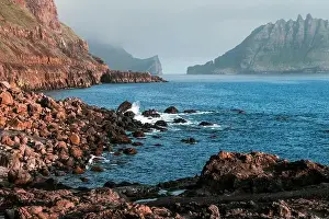 Dramatic view on Drangarnir and Tindholmur sea stacks in Atlantic ocean from Gasadalur village on Vagar island, Faroe Islands. Landscape photography