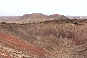Scenic Background Prints: the Dramatic volcanic red deserted crater of Calderon Hondo volcano near to Corralejo