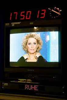 Companies Prints: Dresden, Saxony, clock and MDR-presenter Uta Georgi on a screen
